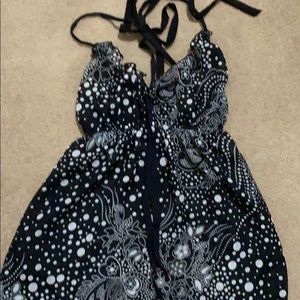 Women’s blouse, black with white dot design.